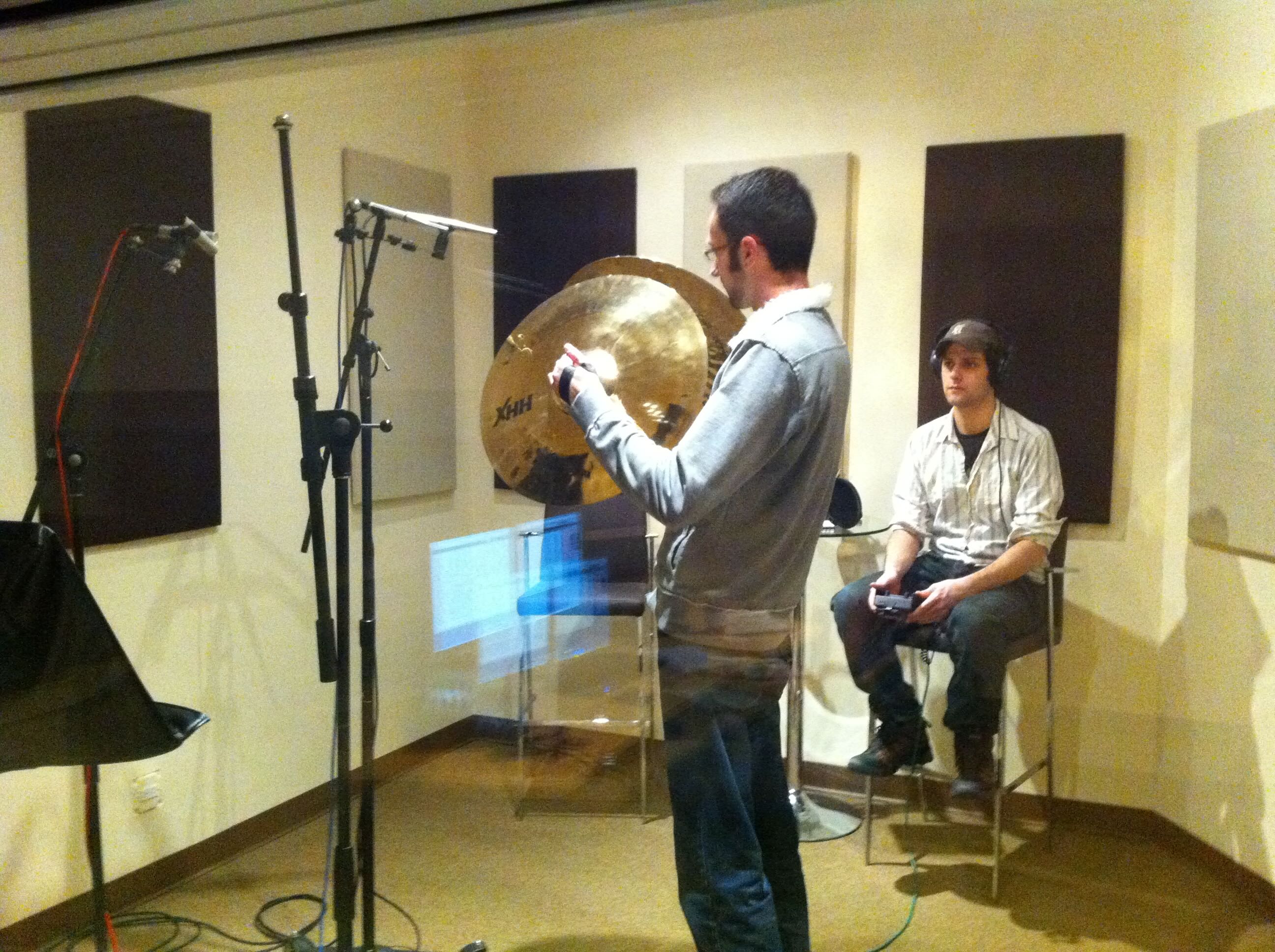 A cymbal performer playing Sabian cymbals into studio microphones at NoiseFloor