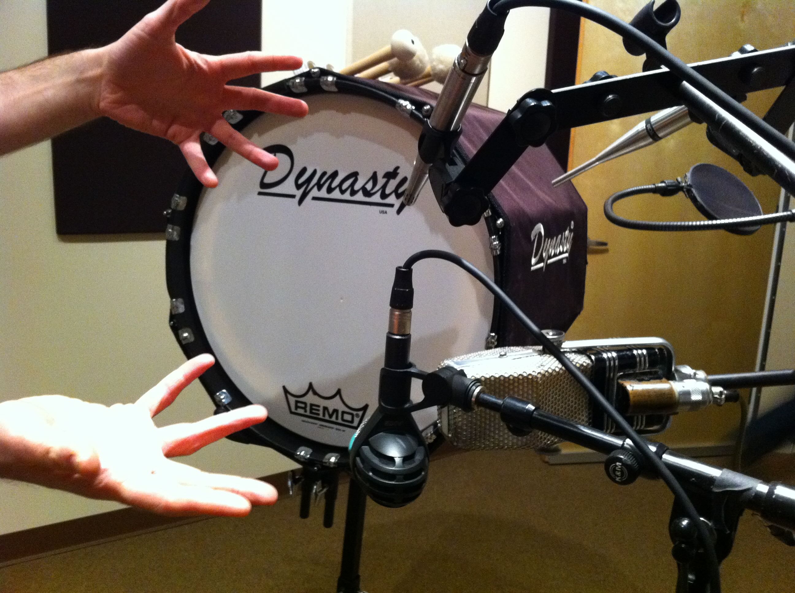 A Dynasty marching bass drum surrounded by microphones during the Drumline recording session